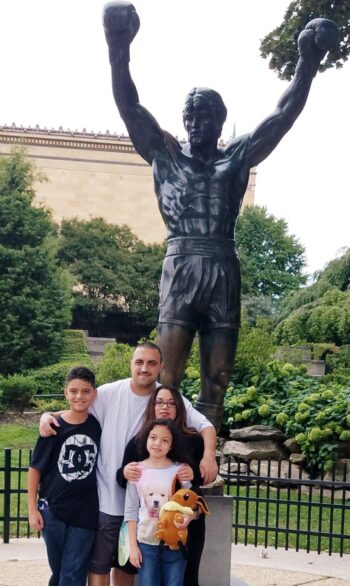 The Fontanez Family in front of the Rocky Statue in Philly