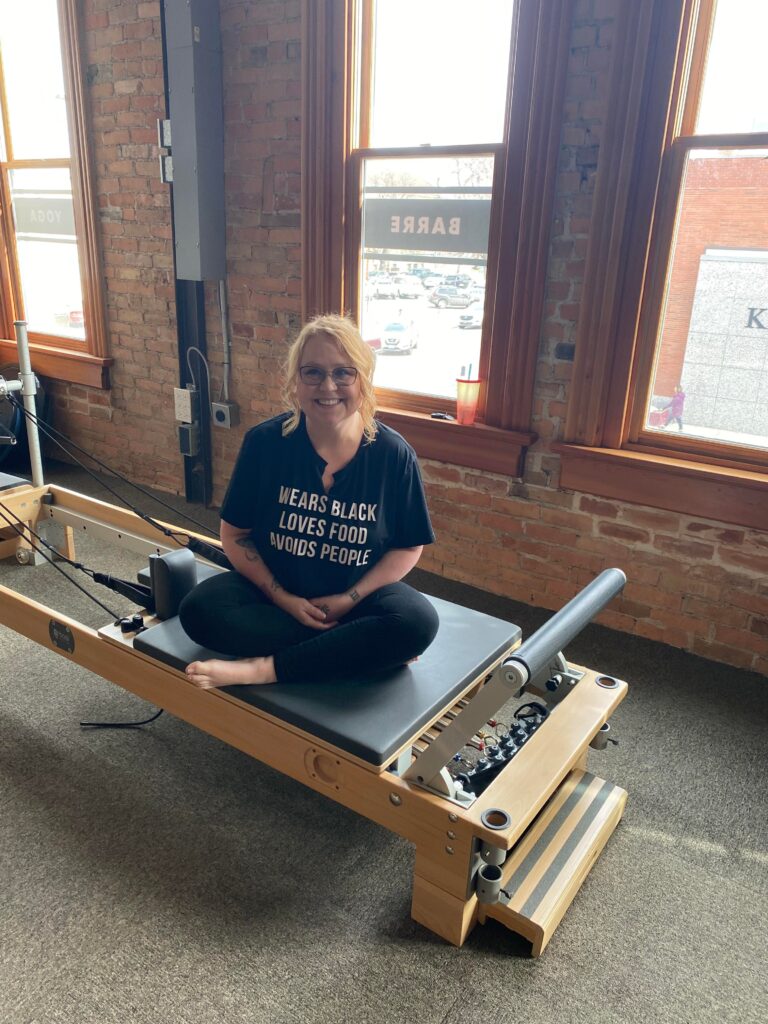 Alison Sonju Ready for Pilates Sitting on a bench smiling