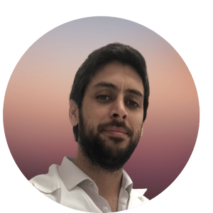 Edgar Carnero Contentti, MD, MSc, FECF is shown wearing a light colored button down collared shirt. He has medium toned skin and dark hair with a dark beard.